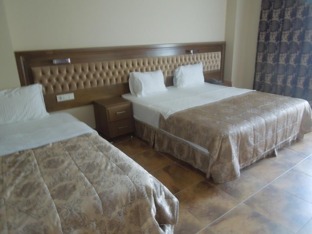 Masi Hotel İmroz Pokoj fotografie