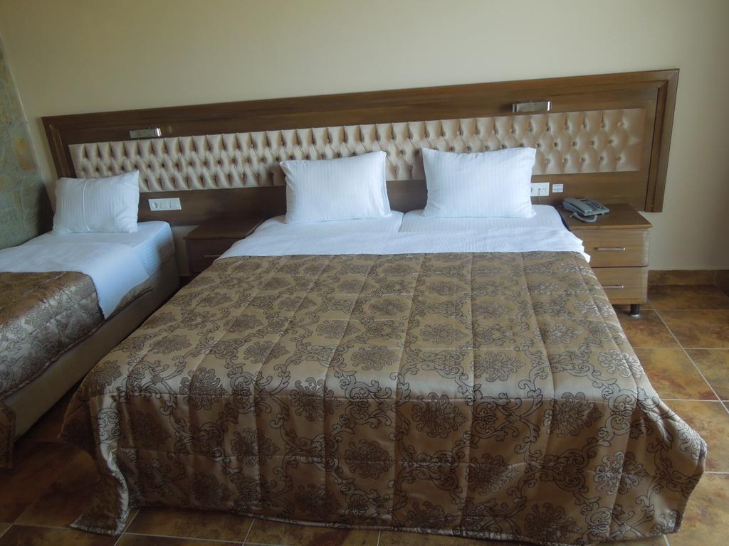 Masi Hotel İmroz Pokoj fotografie